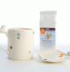 Ensemble de mug et repose sachet de thé moineaux losanges.