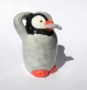 Figurine pingouin qui mange un poisson en faïence - poterie